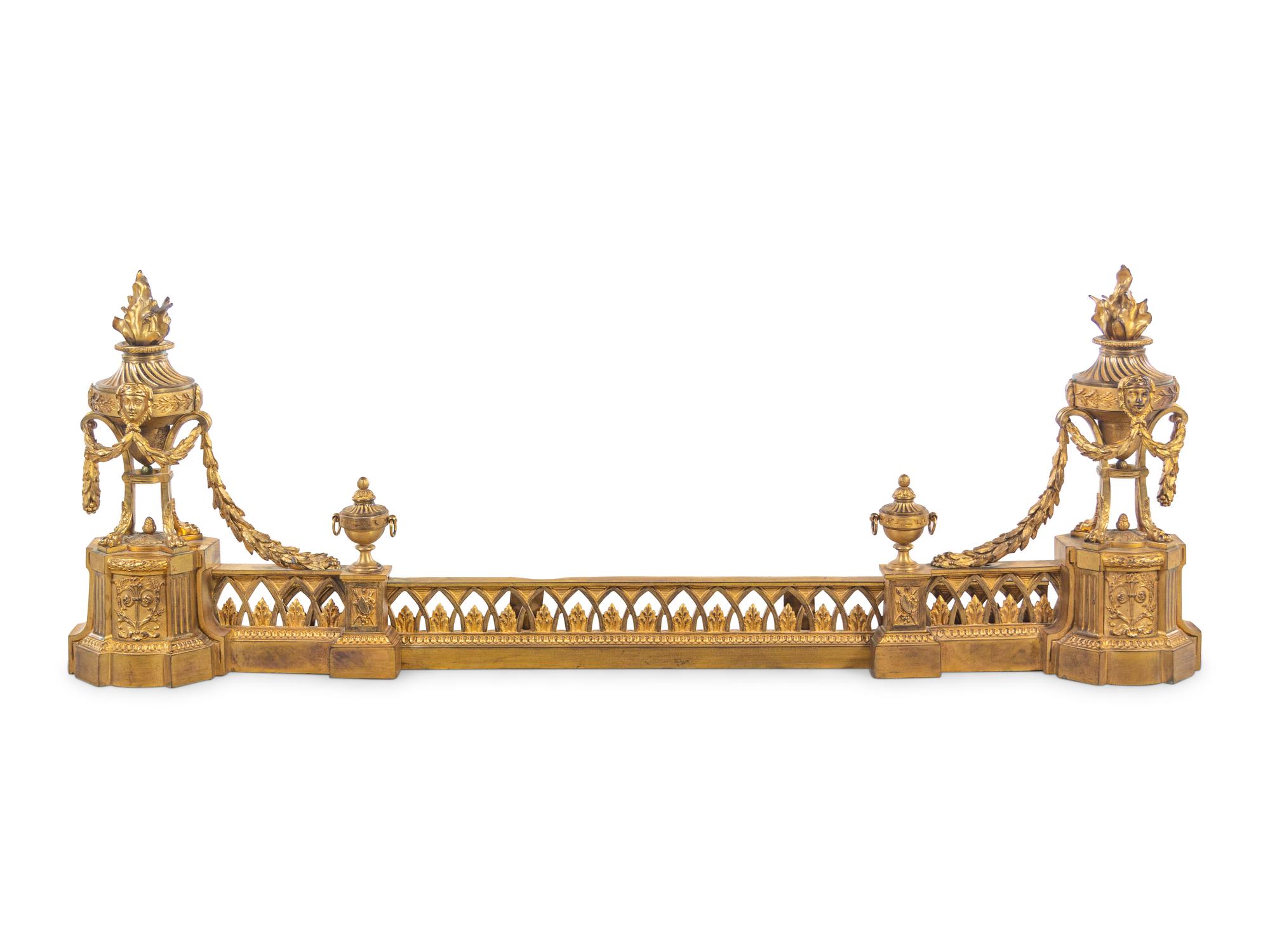 A Louis XVI Style Gilt Bronze Fire Fender with Flaming Urns