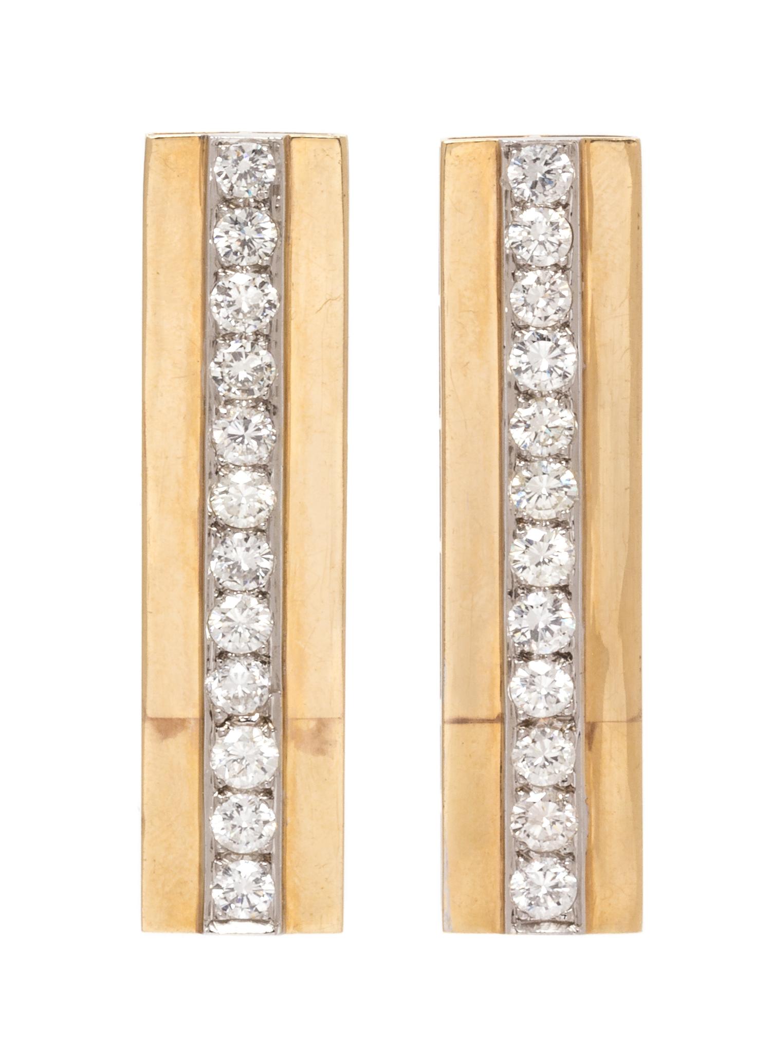 A Pair of Bicolor Gold and Diamond Earclips, 10.70 dwts.