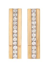 A Pair of Bicolor Gold and Diamond Earclips, 10.70 dwts.