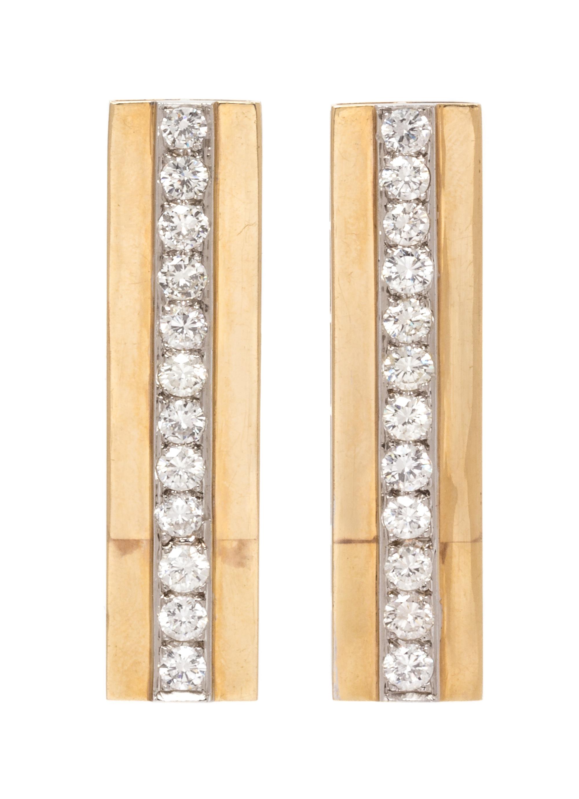 A Pair of Bicolor Gold and Diamond Earclips, 10.70 dwts.