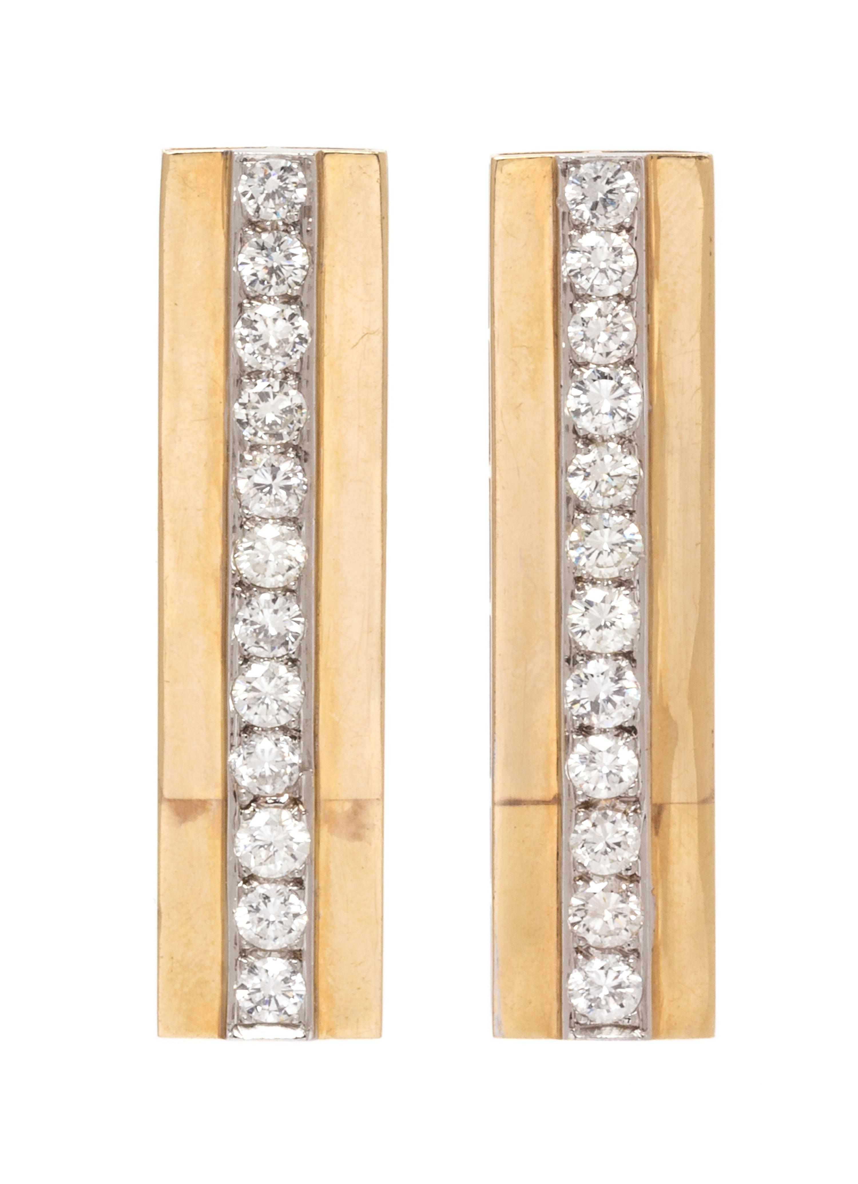 A Pair of Bicolor Gold and Diamond Earclips, 10.70 dwts.