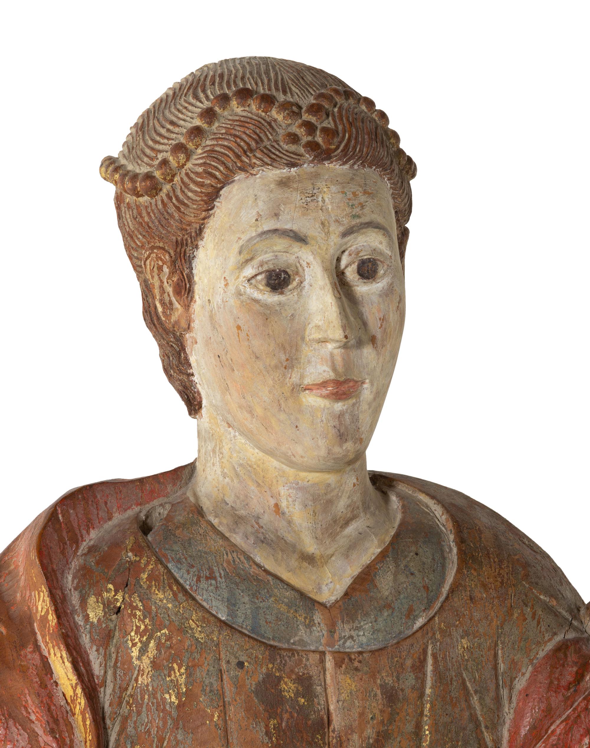 A Continental Carved and Polychromed Santo Figure