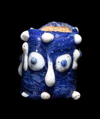 A Phoenician Glass Triple-Face Bead