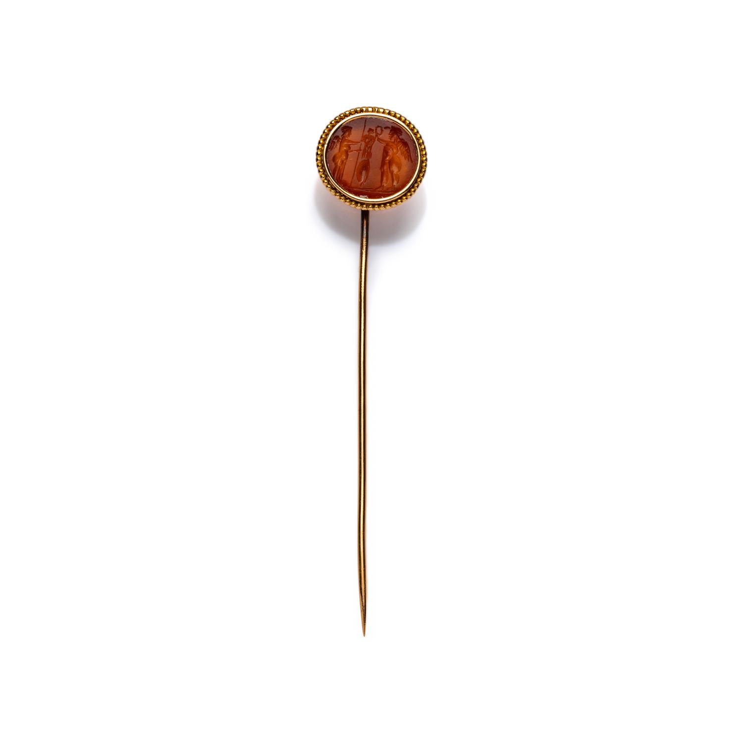 A Roman Carnelian Intaglio with Two Erotes Flanking a Tropaion — Set in a 19th century gold pin