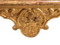 A Pair of Italian Baroque Carved Giltwood Console Tables