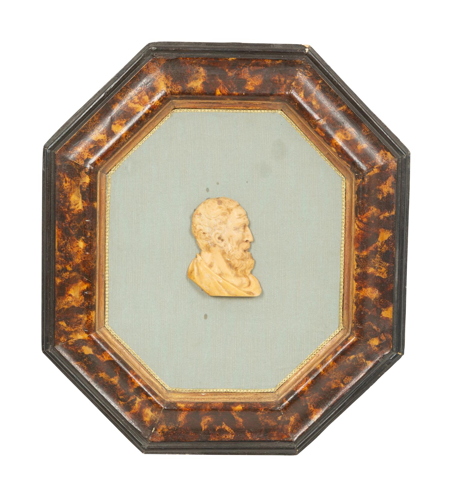 A Pair of Continental Faux Tortoiseshell Painted Framed Composition Plaques of Profile Busts