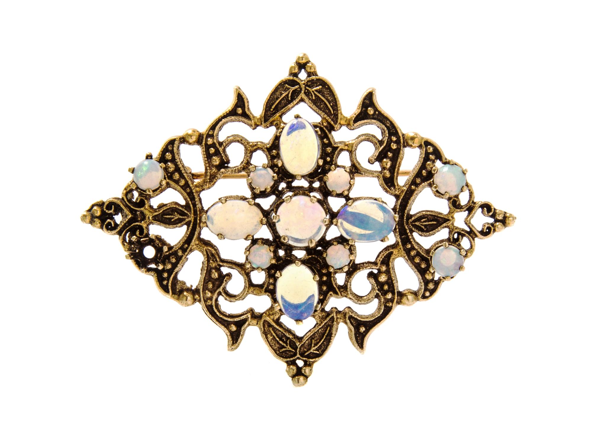 A 14 Karat Yellow Gold and Opal Pendant/Brooch, 6.40 dwts.