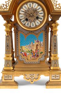 A French Gilt Bronze and Painted Porcelain Clock Garniture