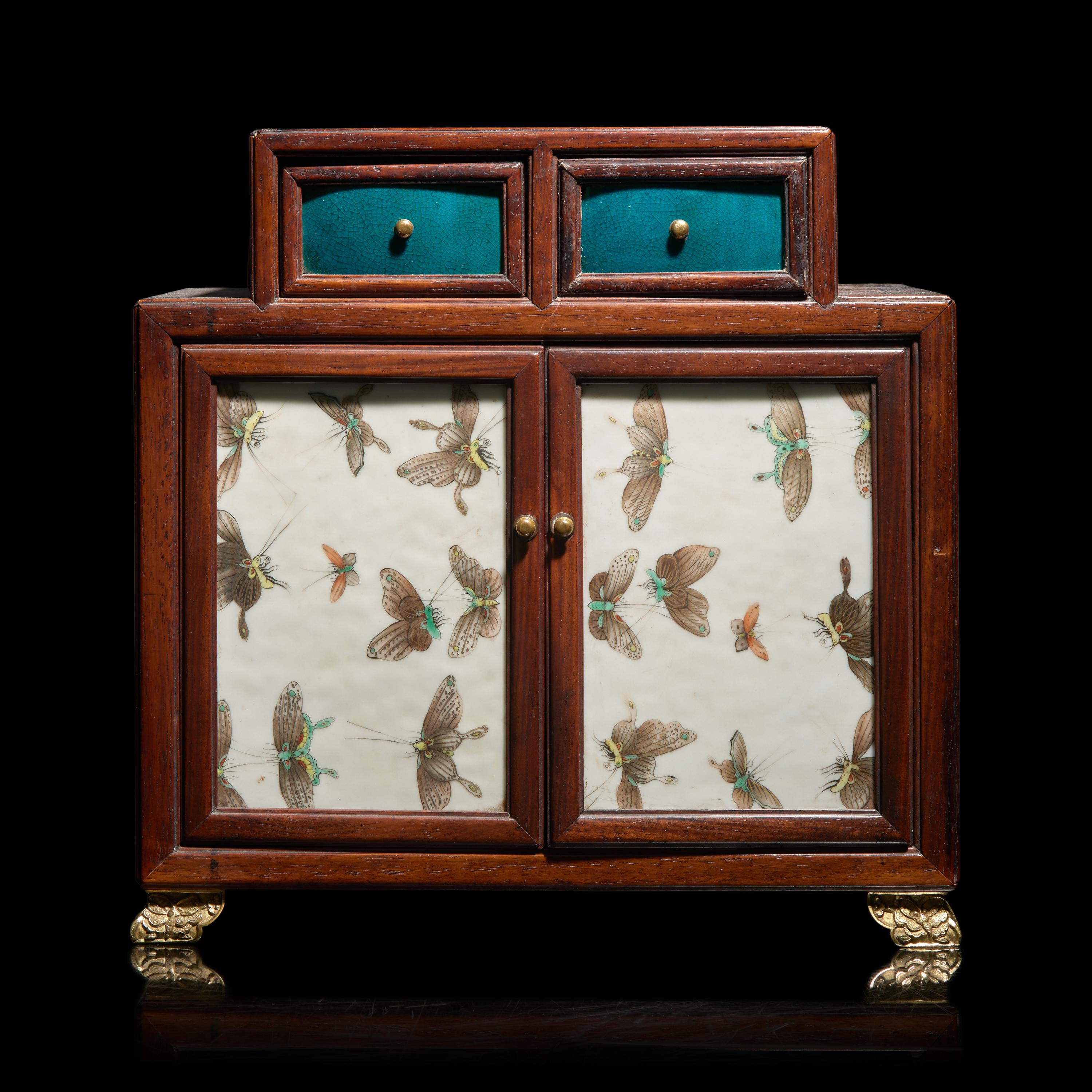 A Small Chinese Porcelain-Inlaid Hardwood Table Cabinet — 硬木嵌粉彩瓷板案頭櫃