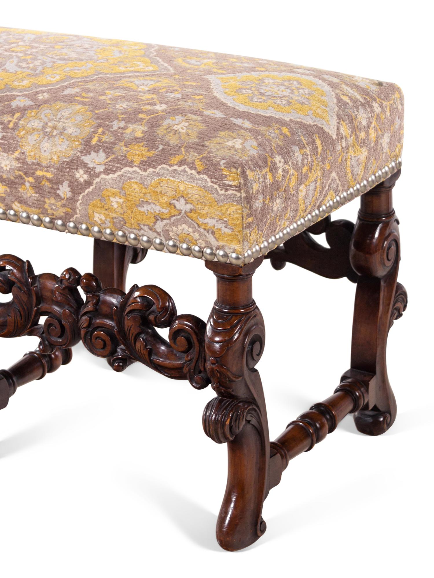 A Pair of William and Mary Style Carved Walnut Benches