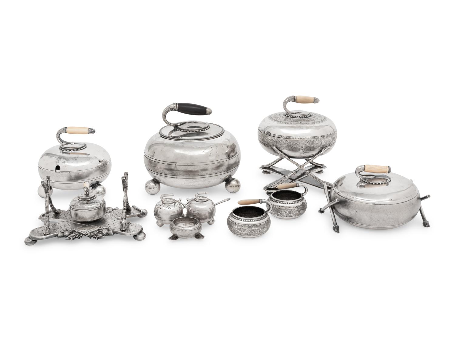 A Group of Eight Curling Stone-Form Silver-Plate Table Articles