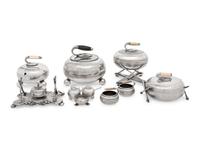 A Group of Eight Curling Stone-Form Silver-Plate Table Articles