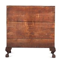 A Chippendale Carved and Figured Mahogany Reverse-Serpentine Claw-and-Ball Foot Slant-Front Desk