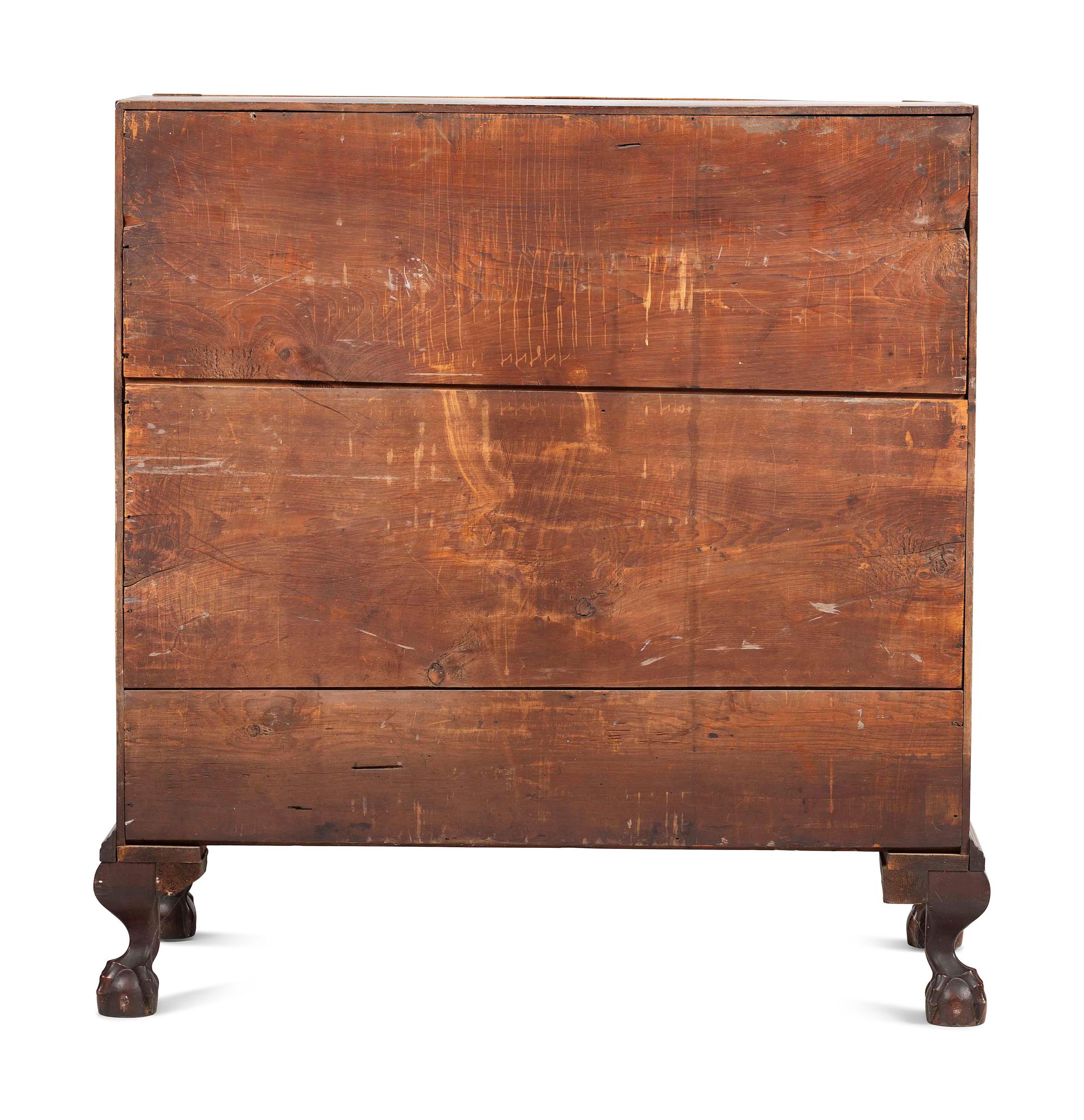 A Chippendale Carved and Figured Mahogany Reverse-Serpentine Claw-and-Ball Foot Slant-Front Desk