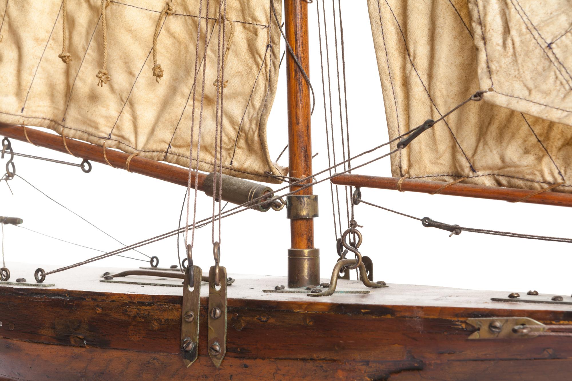 A Brass Mounted Painted Wood Pond Boat