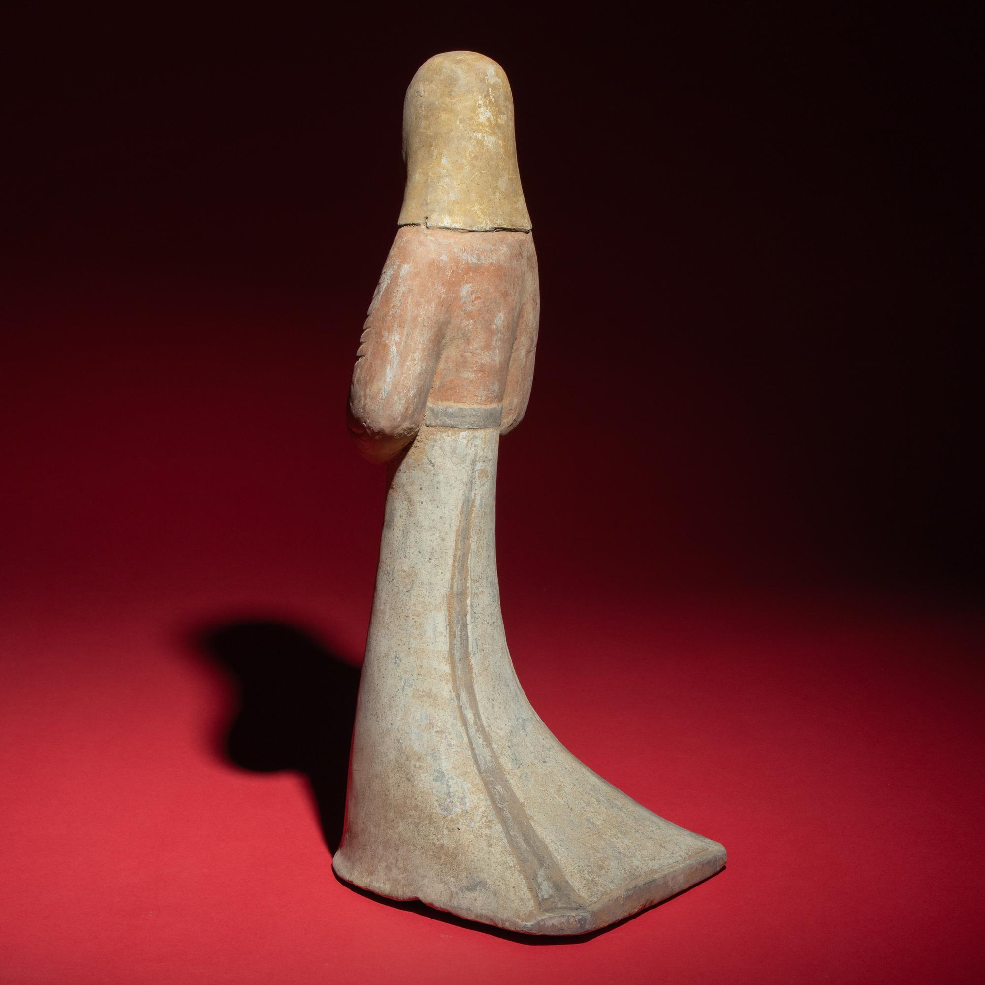 A Large Chinese Painted Pottery Standing Lady Wearing a Hood, Han Dynasty — 漢 大型灰陶彩繪風帽喇叭裙女俑