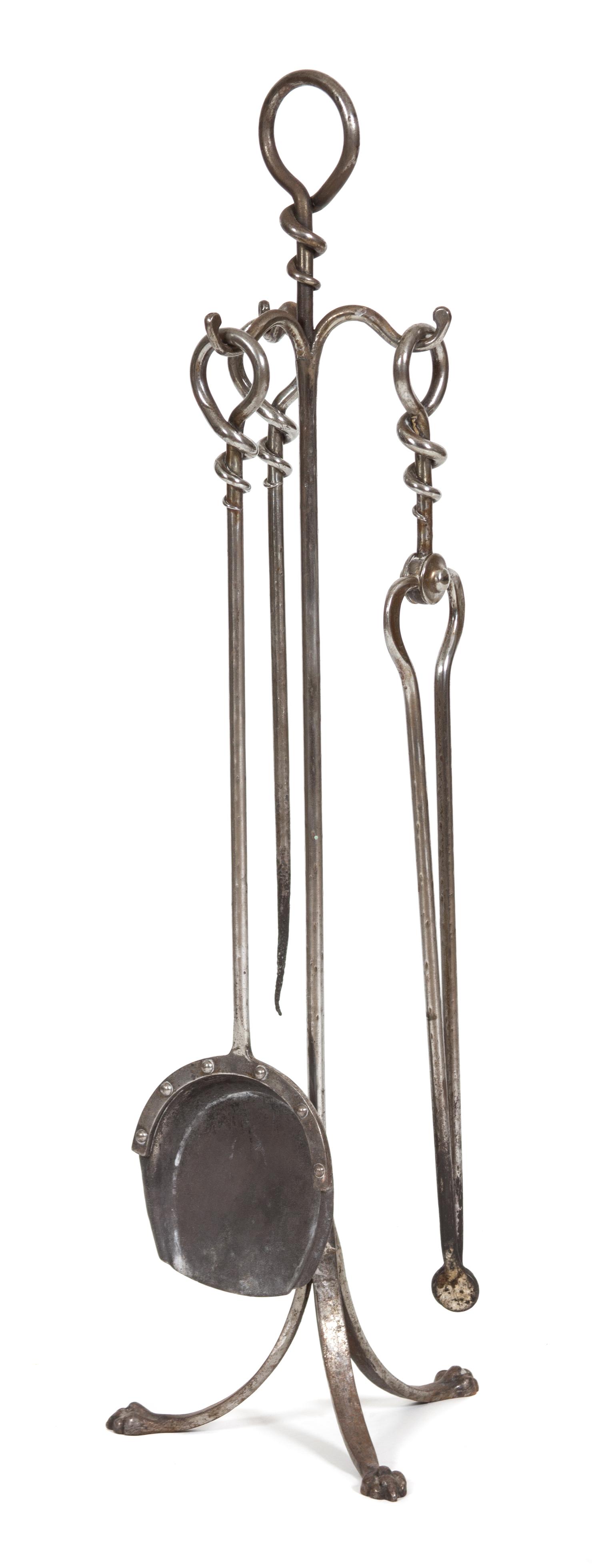 A Steel Fire Tool Set on Stand Height of stand 36 1/4 inches. — 20TH CENTURY