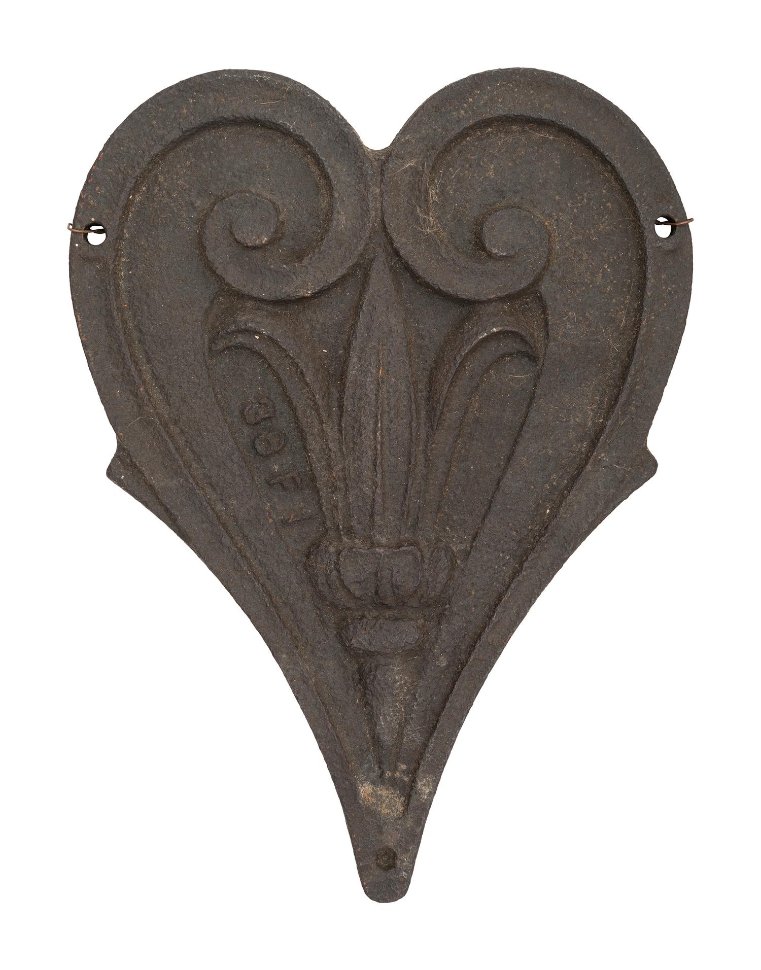 A Pair of Cast Iron Kettle Toppers and Two Trivets