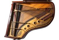 A Steinway and Sons Mahogany Baby Grand Piano