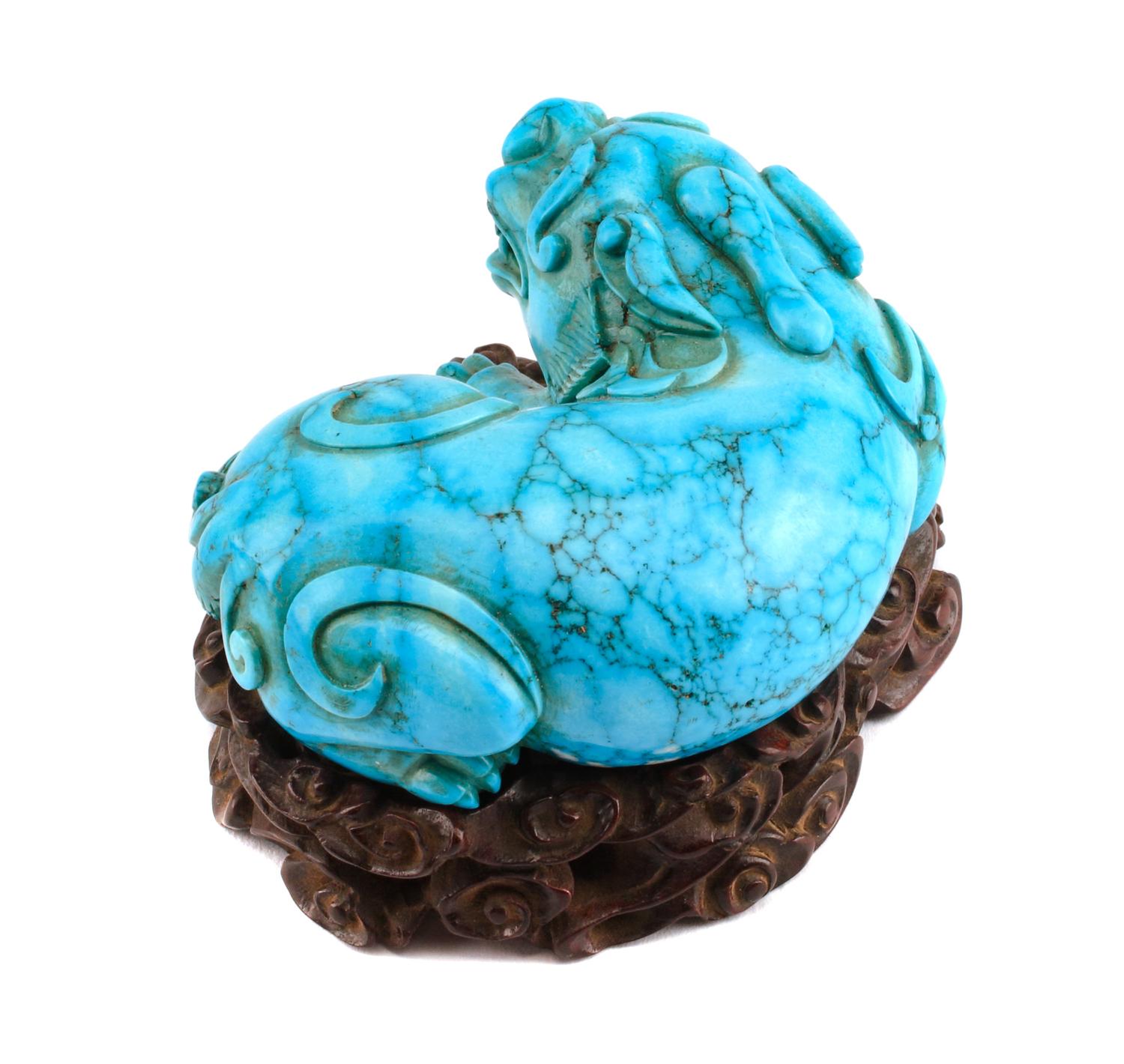 A Chinese Carved Turquoise Figure Height 1 1/2 inches.
