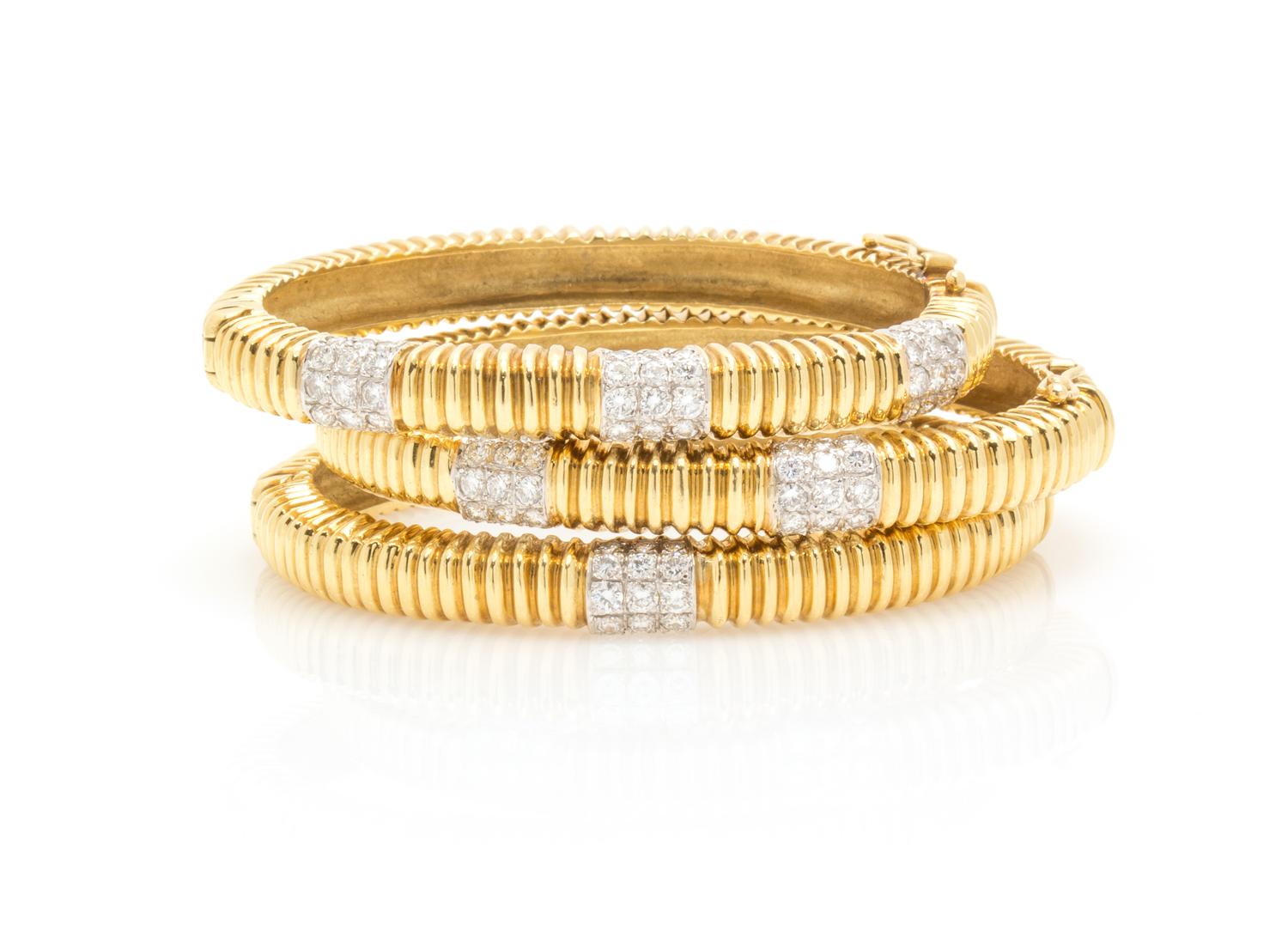 A Collection of 18 Karat Gold and Diamond Bangle Bracelets, 71.20 dwts.