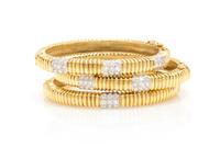 A Collection of 18 Karat Gold and Diamond Bangle Bracelets, 71.20 dwts.