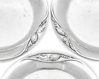A Set of Nine Georg Jensen Silver Blossom Pattern Bread Plates