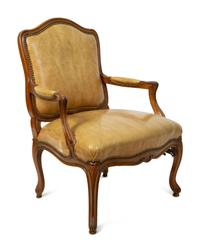 A French Provincial Style Leather Upholstered Fauteuil — 19TH CENTURY