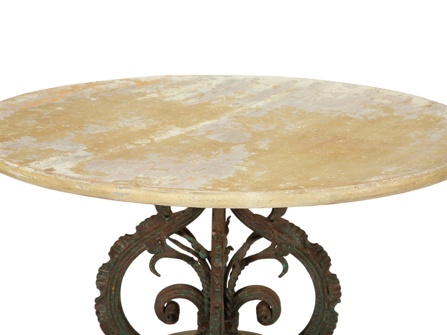 A Bronze and Stone Table with an Inlaid Stone Top