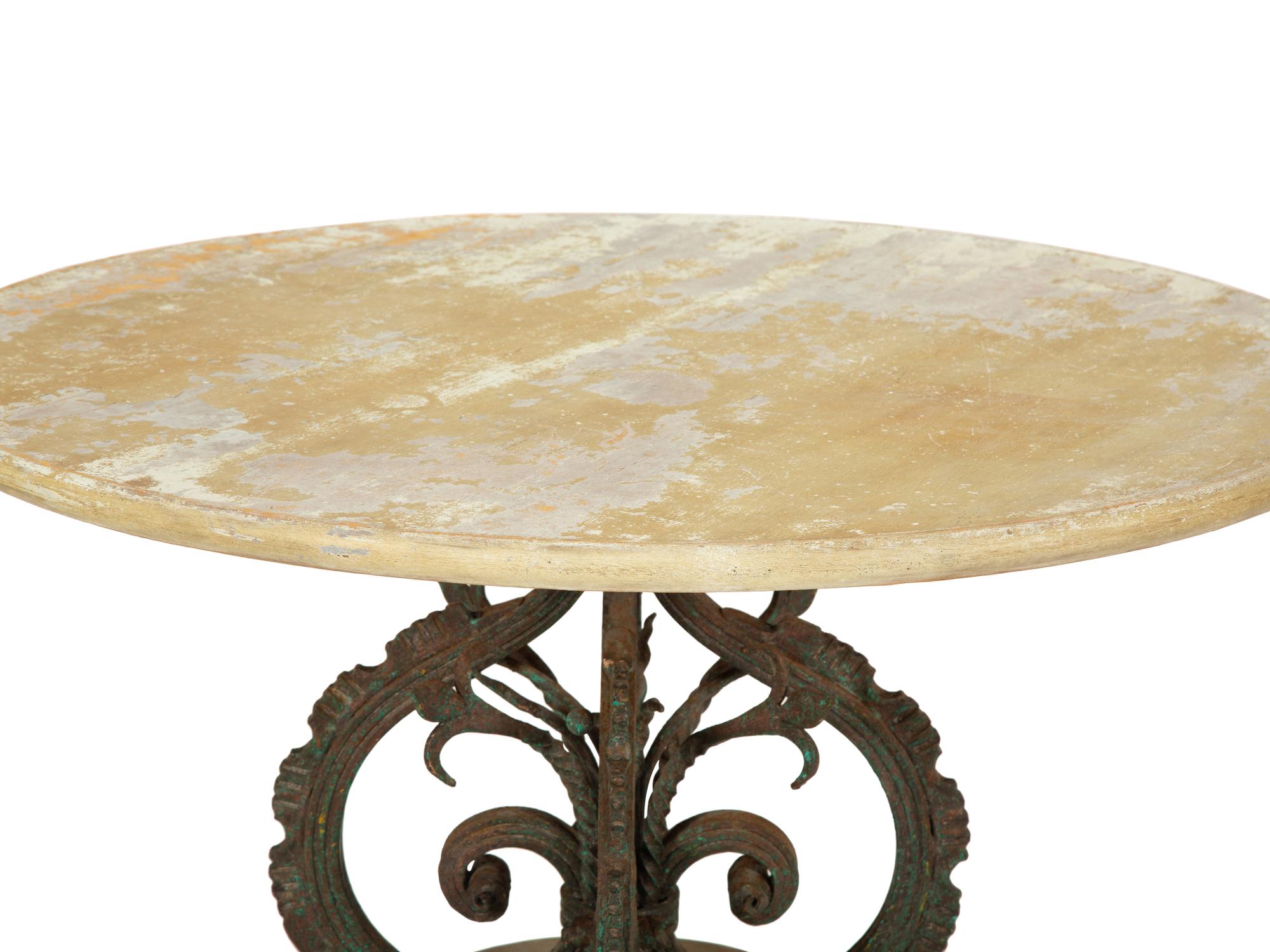 A Bronze and Stone Table with an Inlaid Stone Top