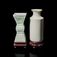 Two Chinese Monochrome Porcelain Vases, 19th Century 晚清 白釉直筒瓶及豆青釉模印雙龍戲珠紋觚各一