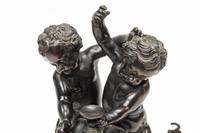 A Continental Patinated Bronze Figural Group After Claude Michel (Clodion)
