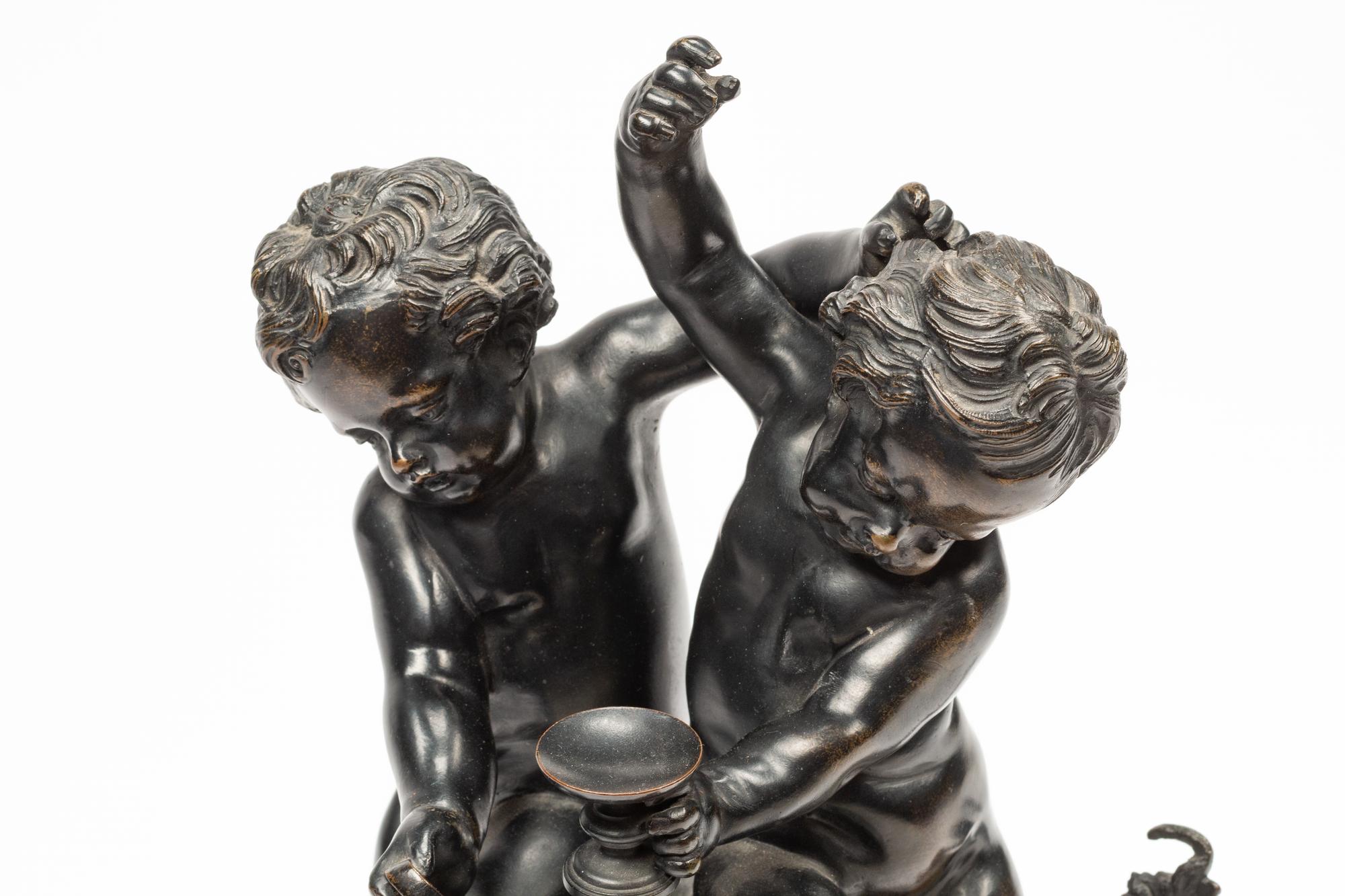 A Continental Patinated Bronze Figural Group After Claude Michel (Clodion)