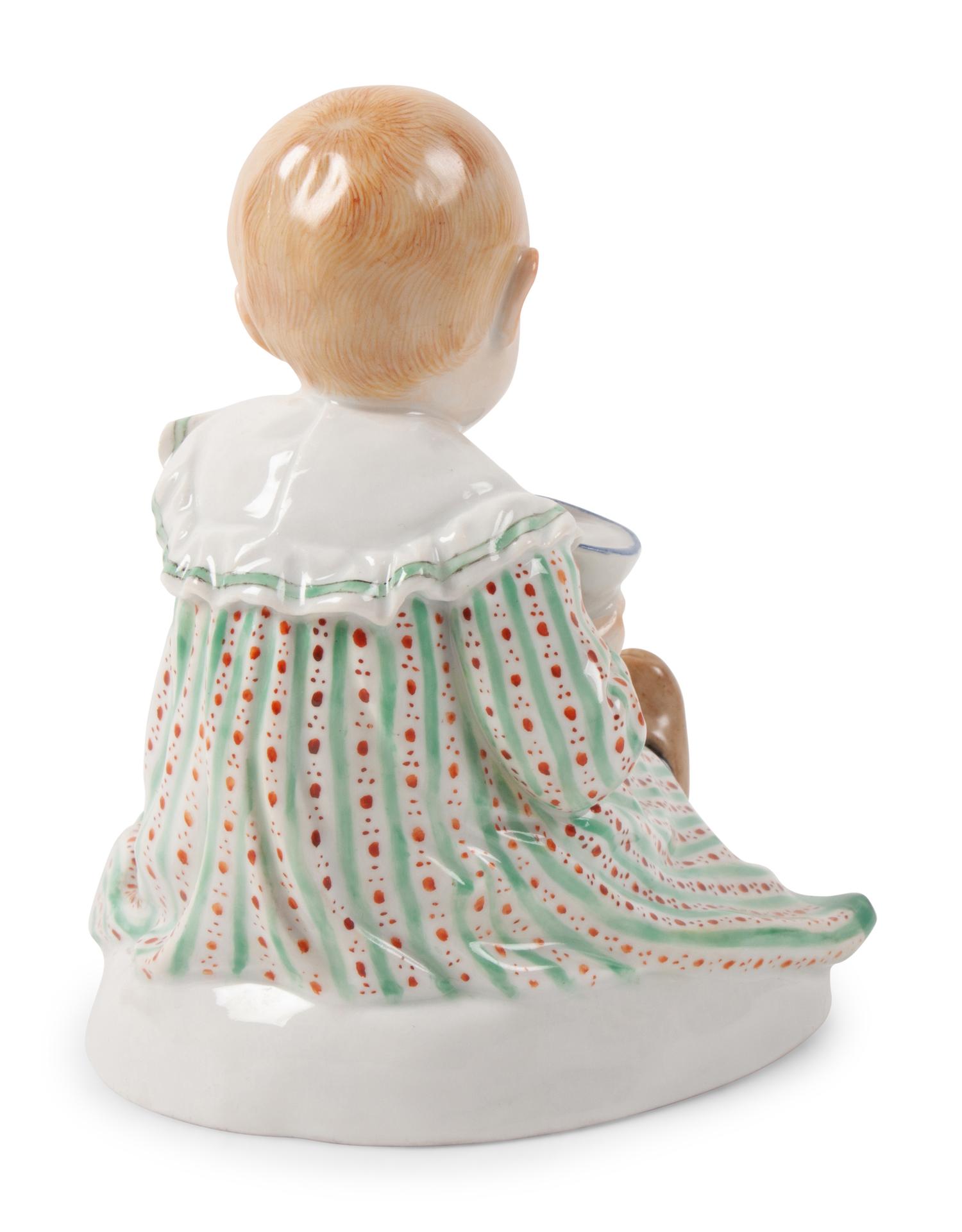A Meissen Porcelain Figure of a Child with Dog