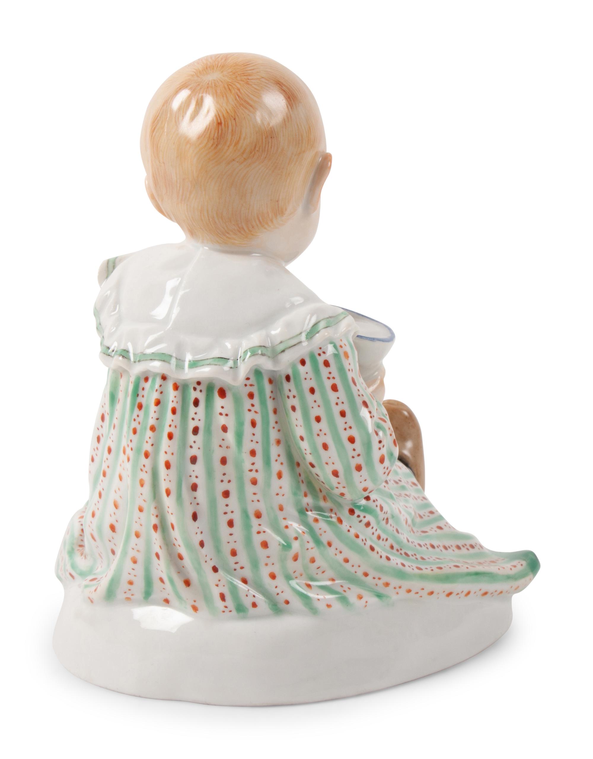 A Meissen Porcelain Figure of a Child with Dog