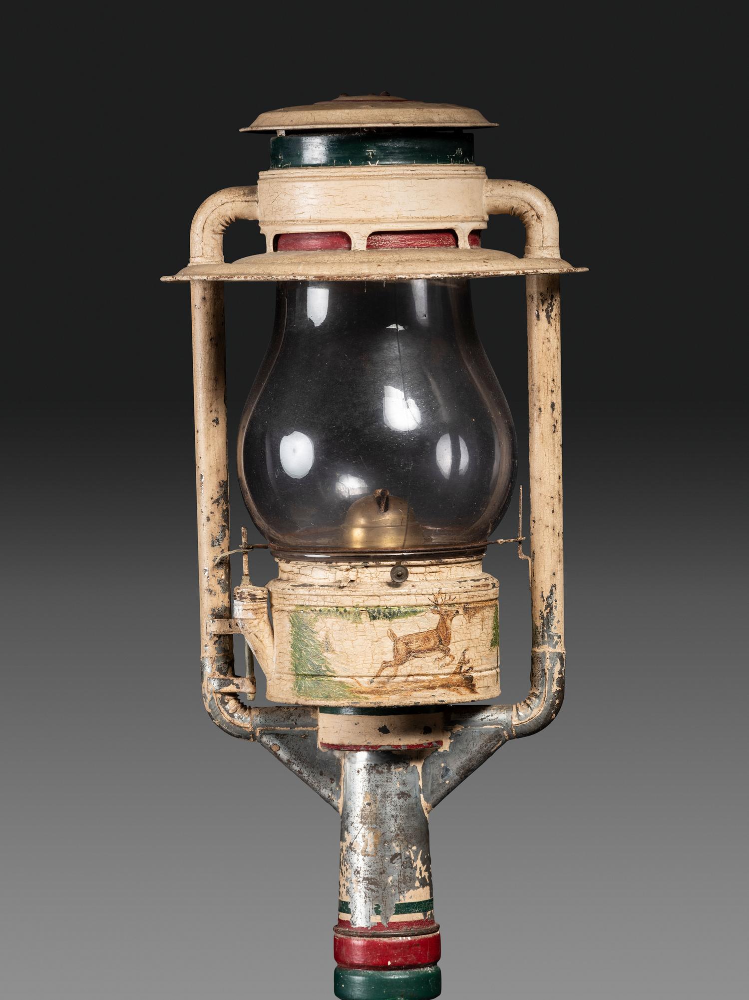 An American Painted Wood and Metal Stag Decorated Oil Lamppost