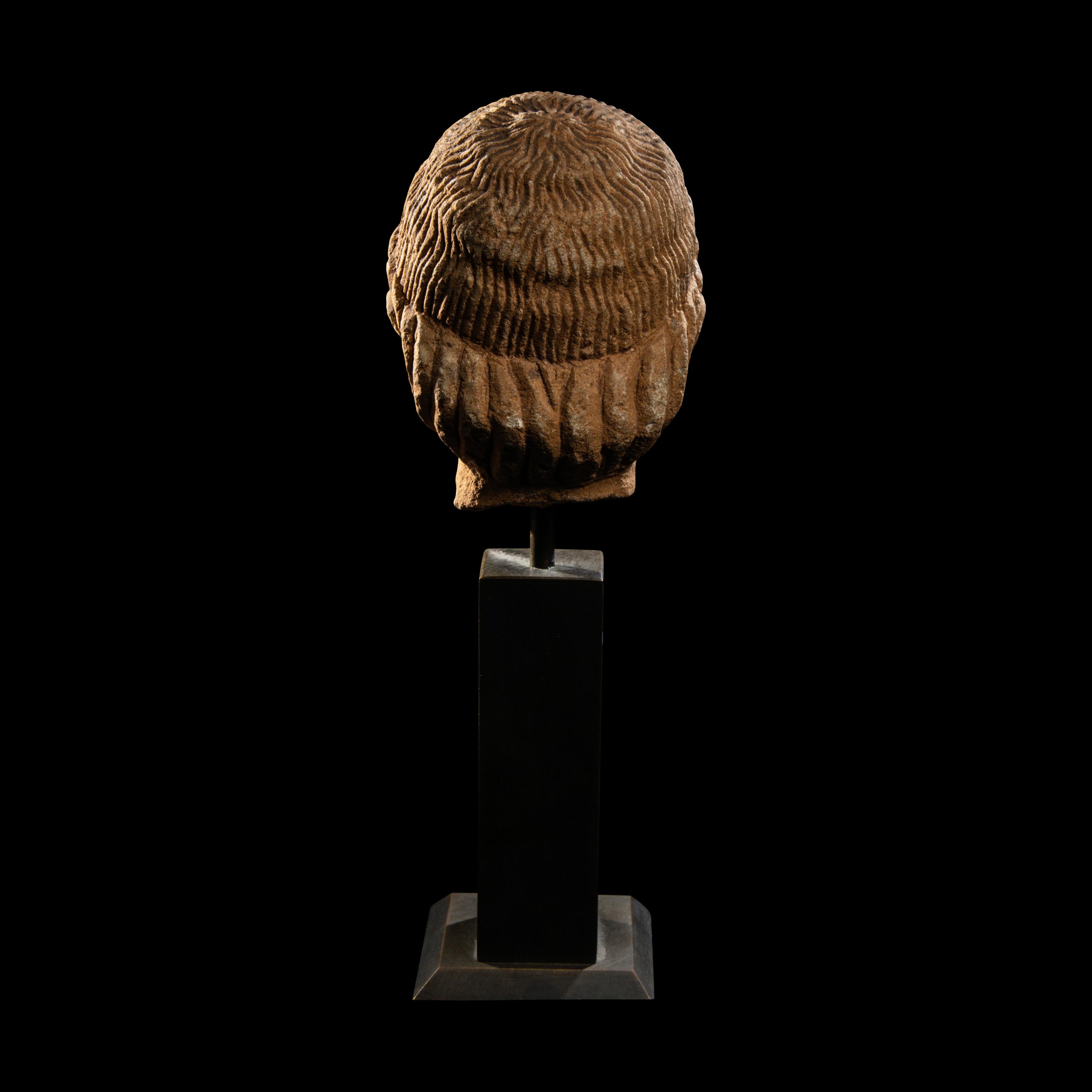 A Cypriot Limestone Head of a Youth