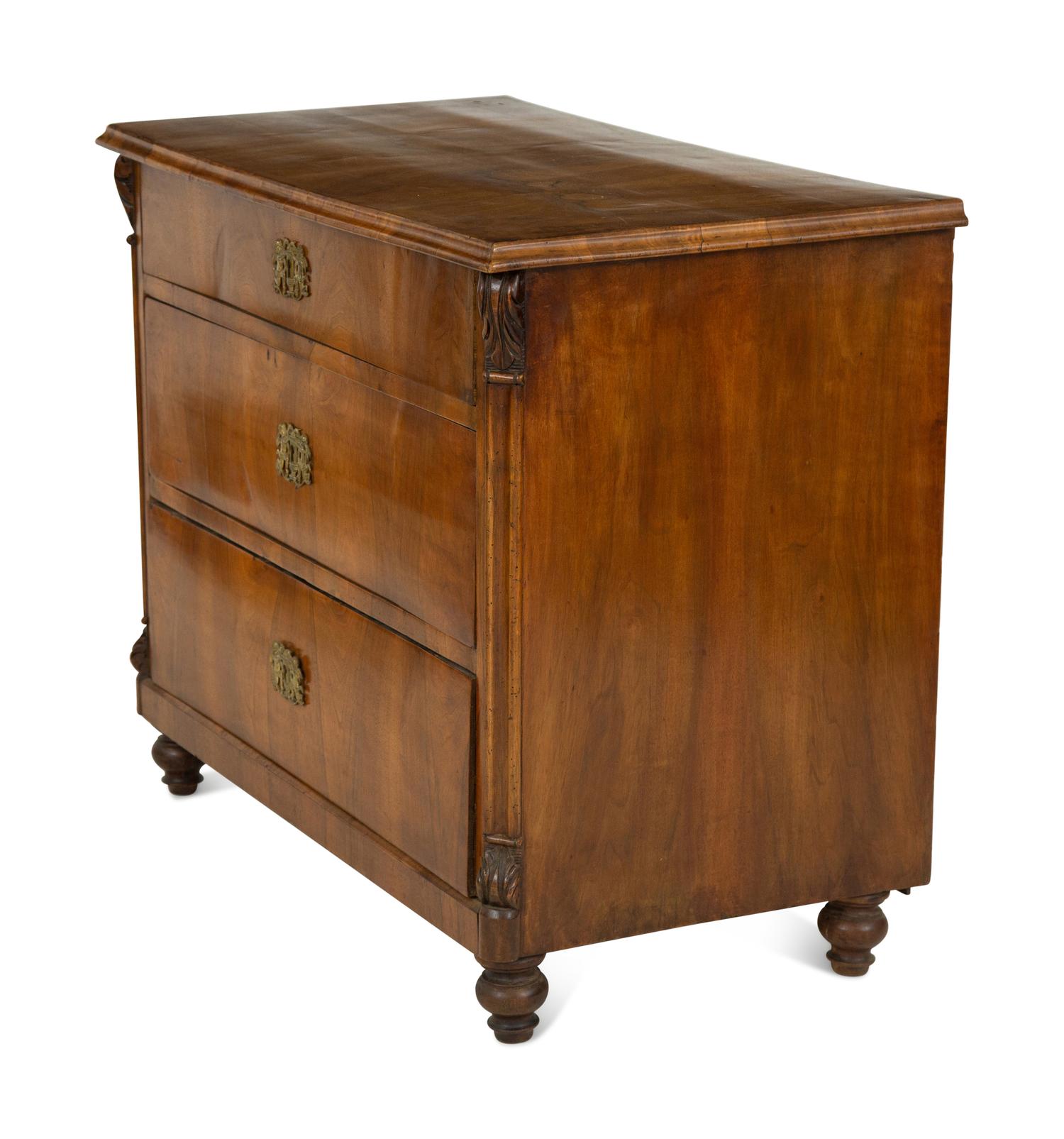 A Continental Walnut Chest of Drawers
