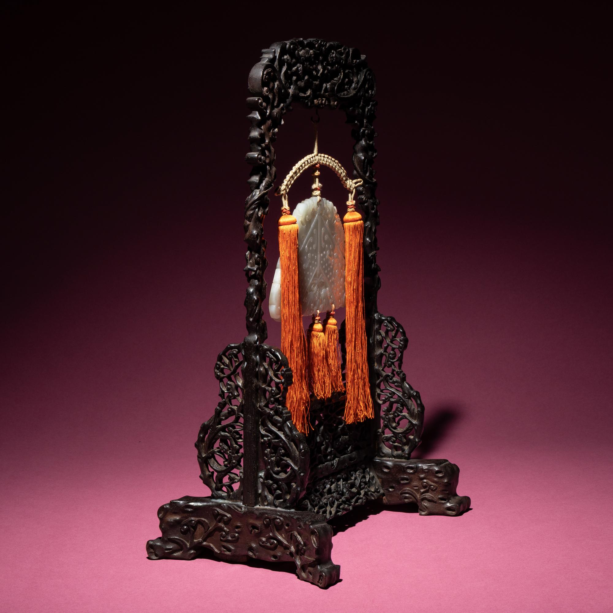 A Chinese White Jade Chime-Form Pendant, 18th/19th Century — 清中期 白玉罄