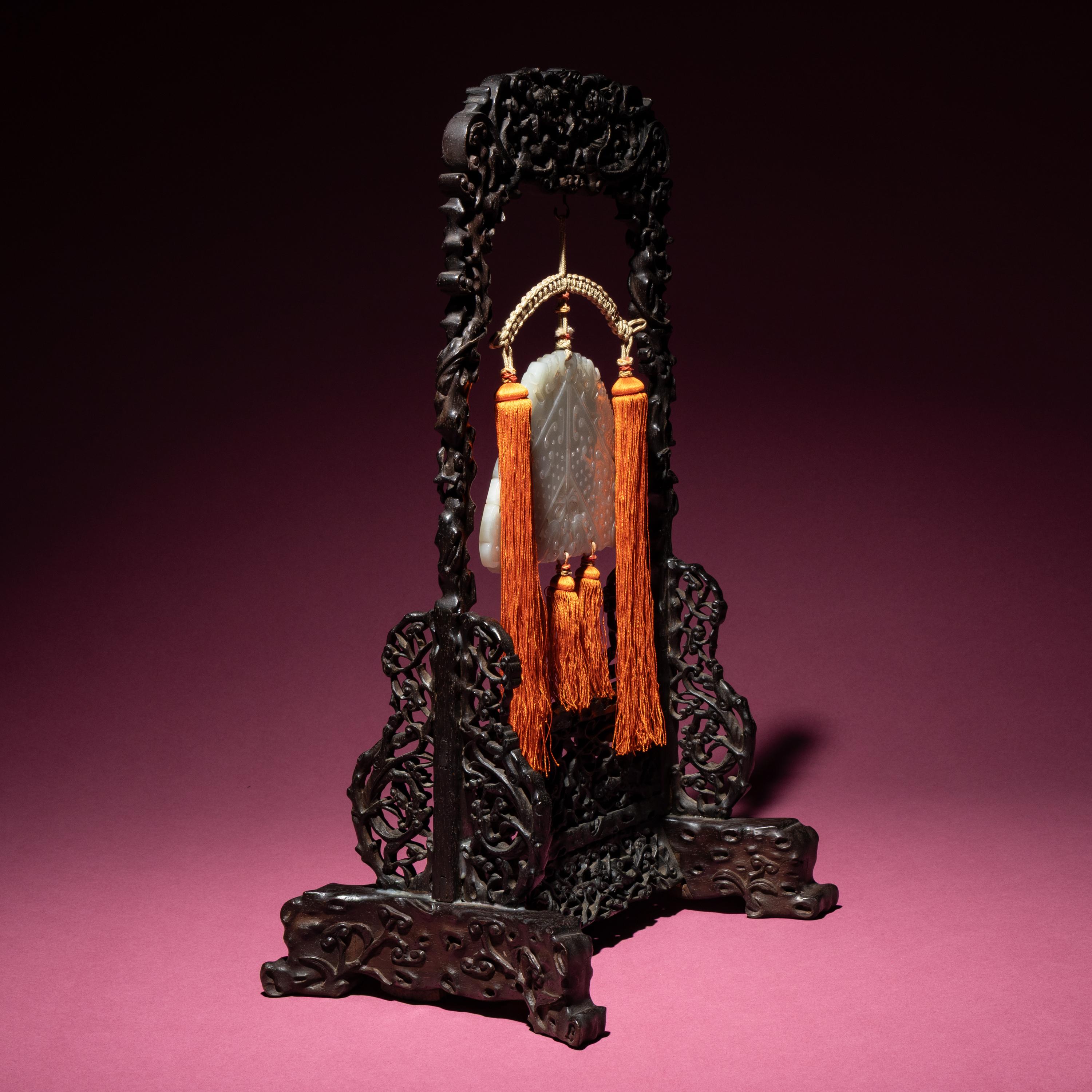 A Chinese White Jade Chime-Form Pendant, 18th/19th Century — 清中期 白玉罄