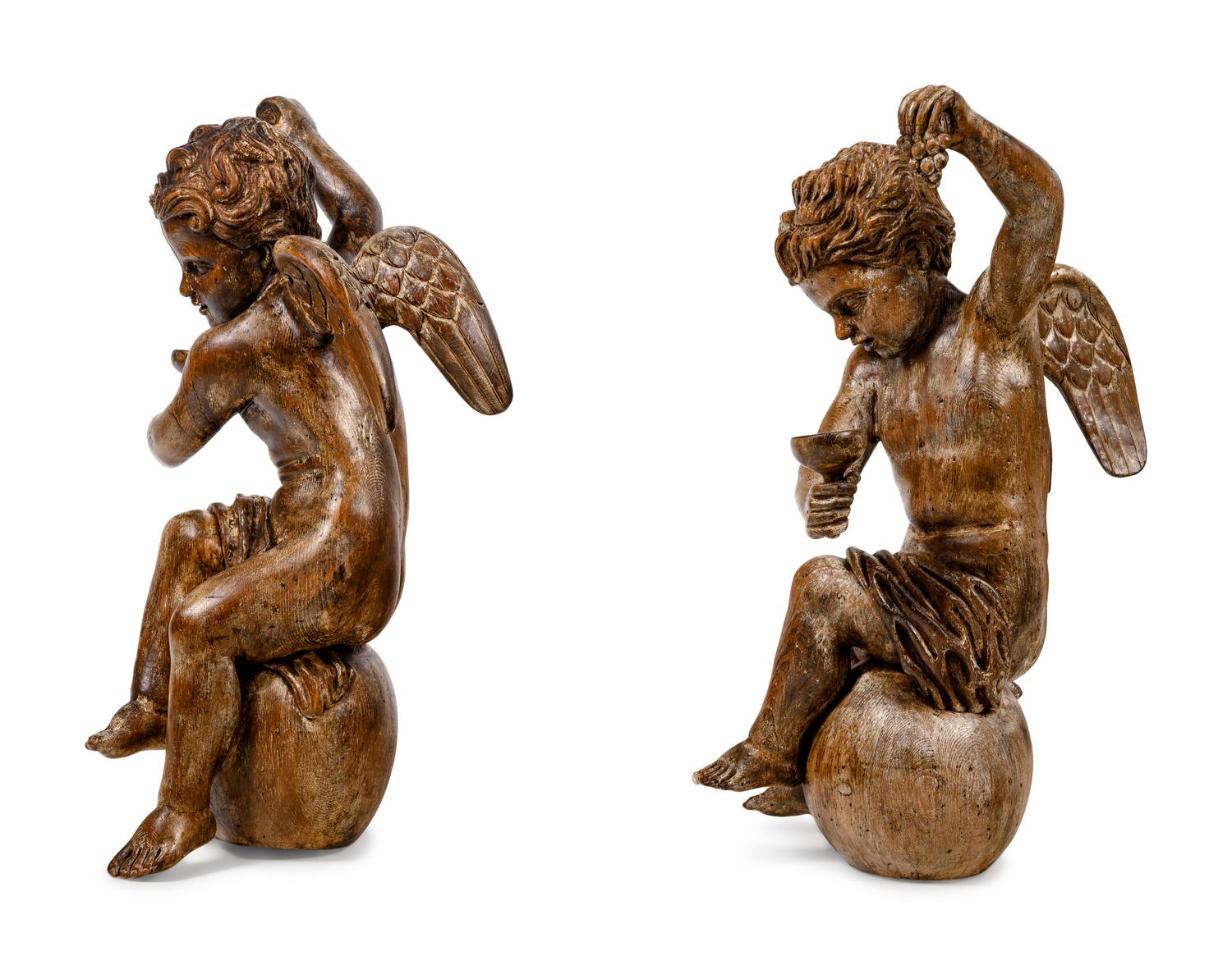 A Pair of Continental Carved Oak Cherubs