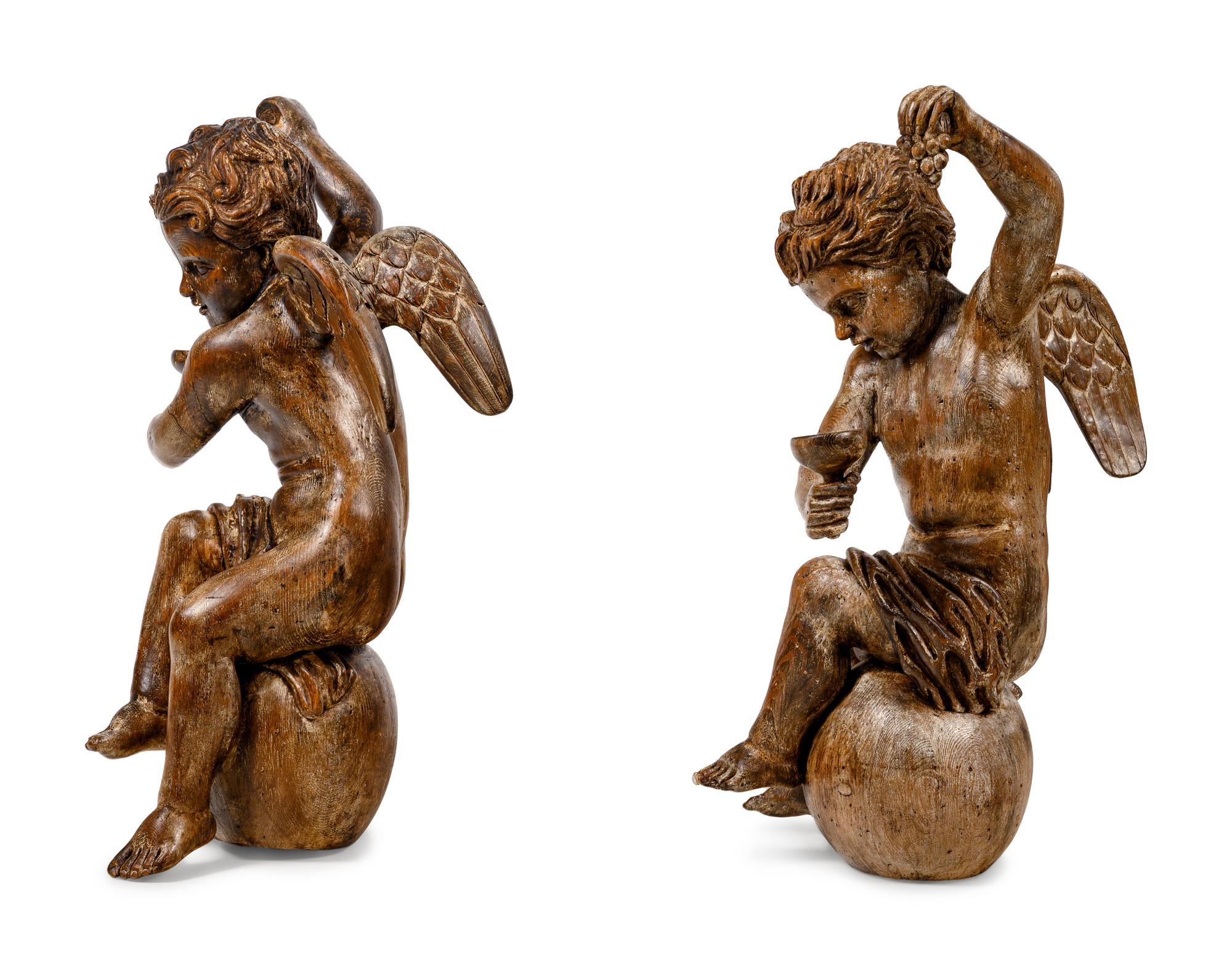A Pair of Continental Carved Oak Cherubs