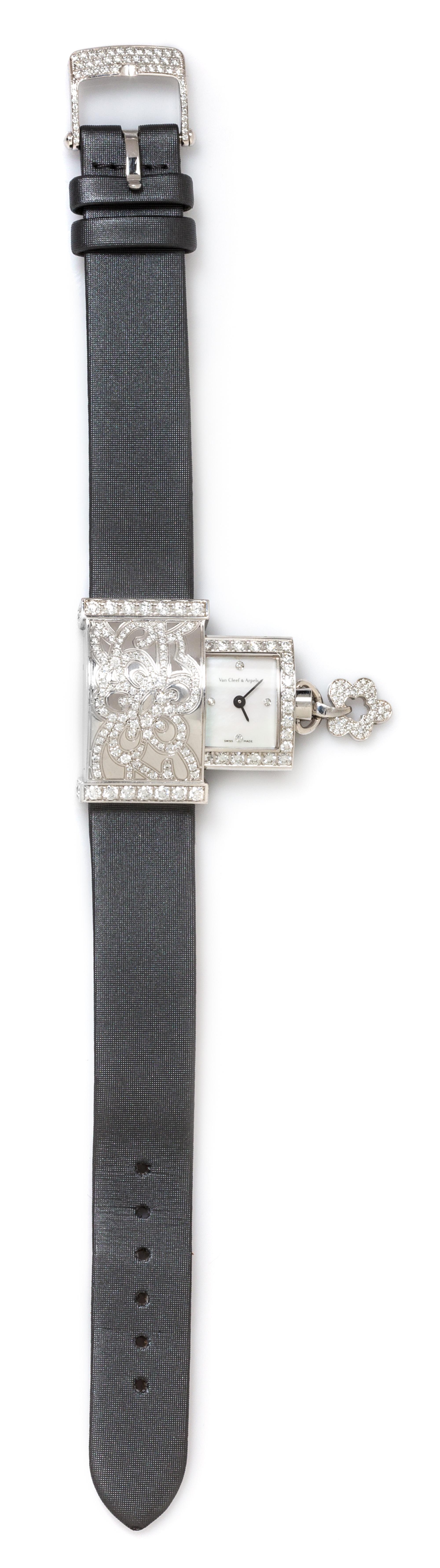 An 18 Karat White Gold, Diamond and Mother-of-Pearl Concealed 'Secret Dentelle' Wristwatch, Van Cleef & Arpels, Circa 2005,