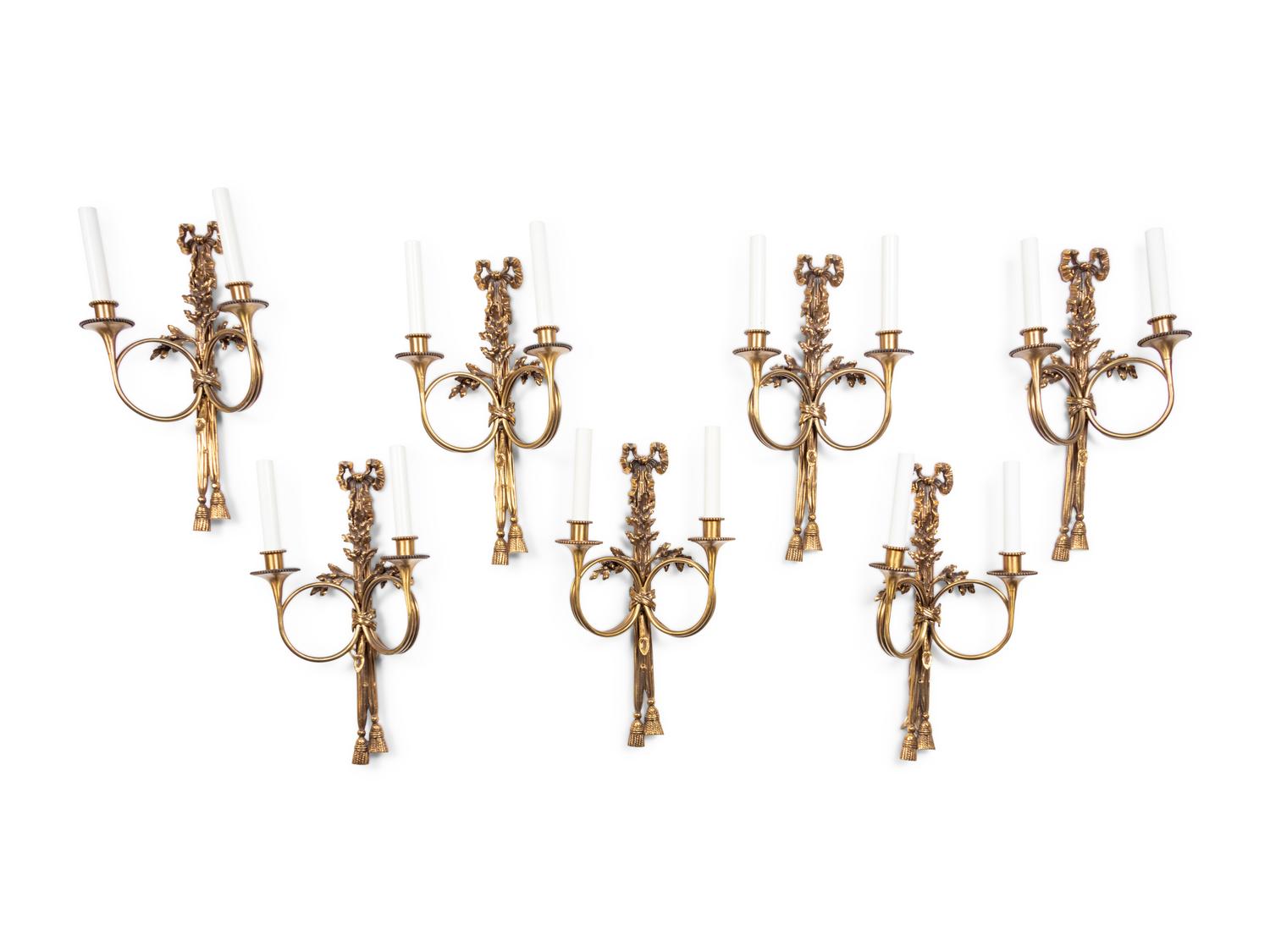 A Set of Seven Louis XVI Style Brass Two-Light Sconces
