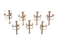 A Set of Seven Louis XVI Style Brass Two-Light Sconces