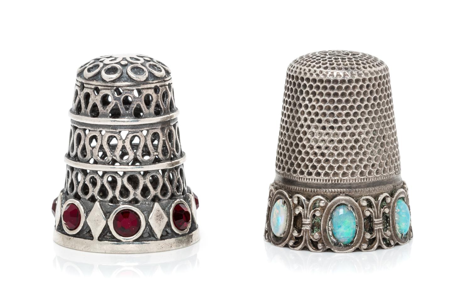 A Group of Two Continental Silver and Stone Thimbles, , comprising an example with three tiers of pierced wrigglework above a band of l
