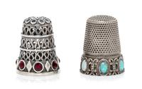 A Group of Two Continental Silver and Stone Thimbles, , comprising an example with three tiers of pierced wrigglework above a band of l