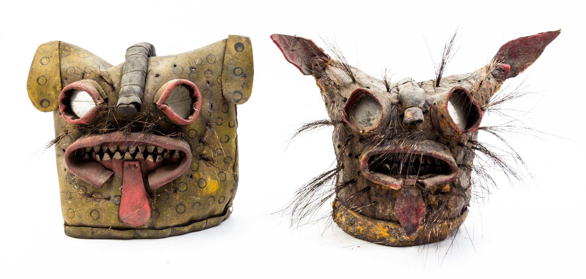 Two Mexican Painted Leather Jaguar Masks Height of first 12 inches.