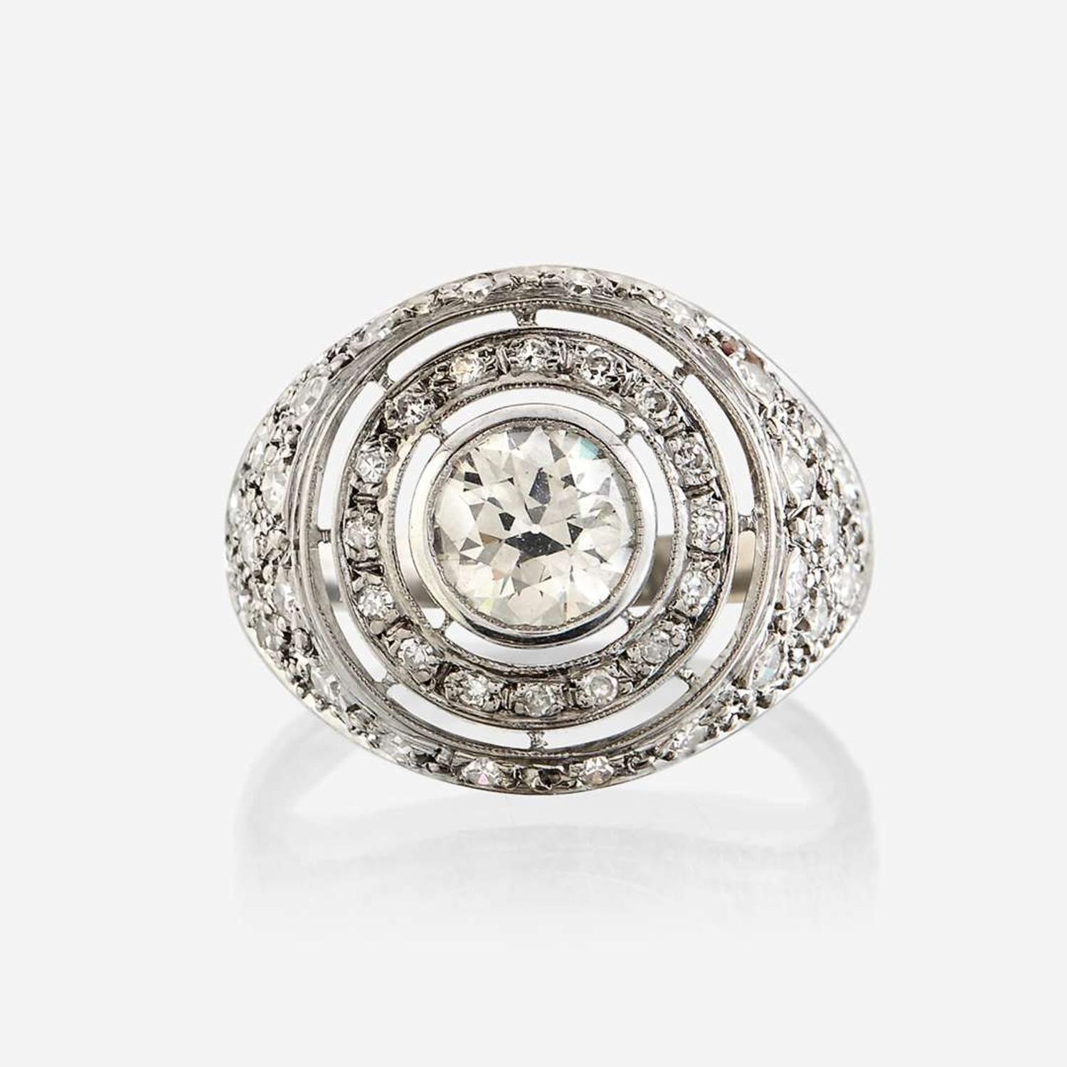 A diamond and eighteen karat white gold ring