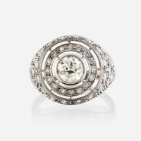 A diamond and eighteen karat white gold ring